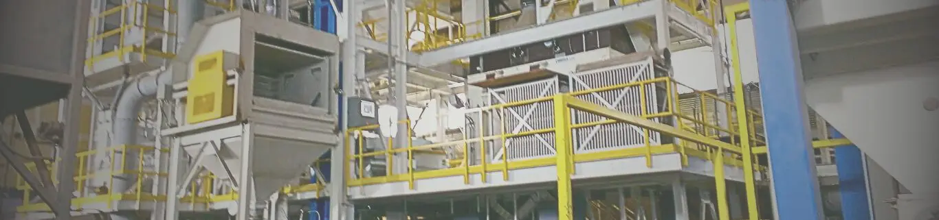 Industrial machinery with yellow and white structures.